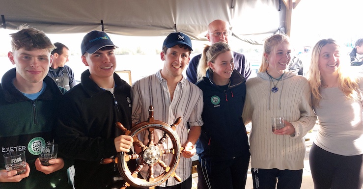 Team of six sailors from Exeter University with the Prince Philip Trophy (a ship's wheel) at the prize giving after winning the RYA National Team Racing Championship 2024.