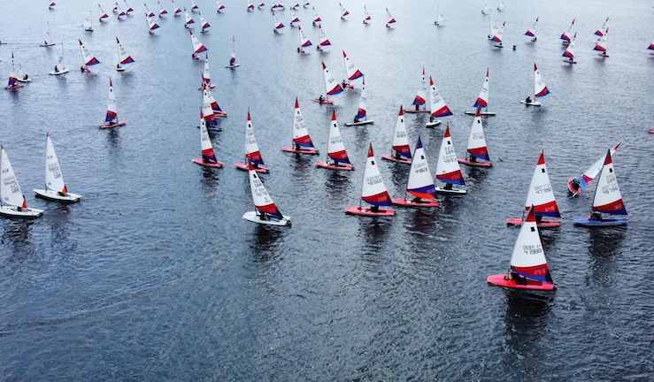 Aerial view of scores of Topper dinghies swarming on Rutland Water for the Eric Twiname Champs 2024