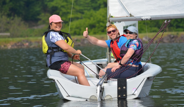 Three smiley people sailing a dinghy on a sunny day at Trimpley SC one of them with a thumbs up :)