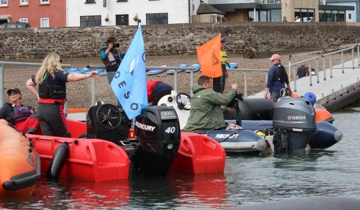 Volunteers on three RIBS alongside the pontoon at Dale getting ready with flags and marks to provide on-water support for the Regional Junior Championships 2024. 