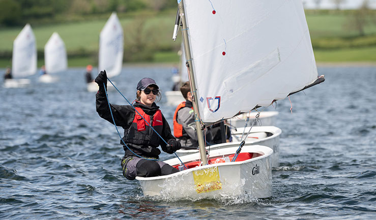 Girl racing an Optimist at the 2024 RYA Eric Twiname Championships