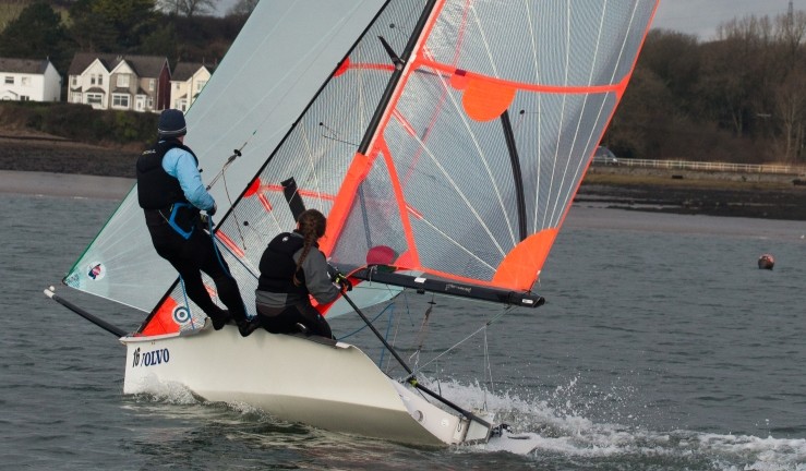 RYA CW Impact Awardee Kiera helming a 29er with kite up at Neyland YC.