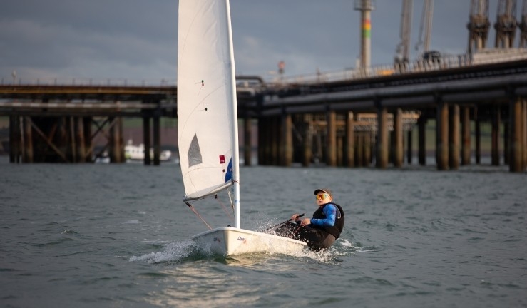 RYA CW Impact Awardee Keira racing an ILCA at Pembrokeshire YC.