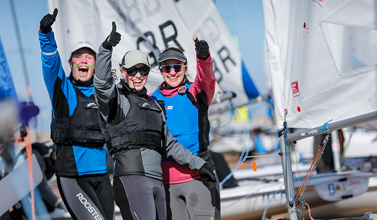 Thumbs up from three young sailors