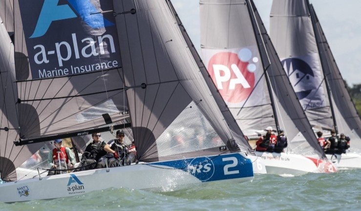Three teams racing RS21s upwind on a sunny day with the British Keelboat League.
