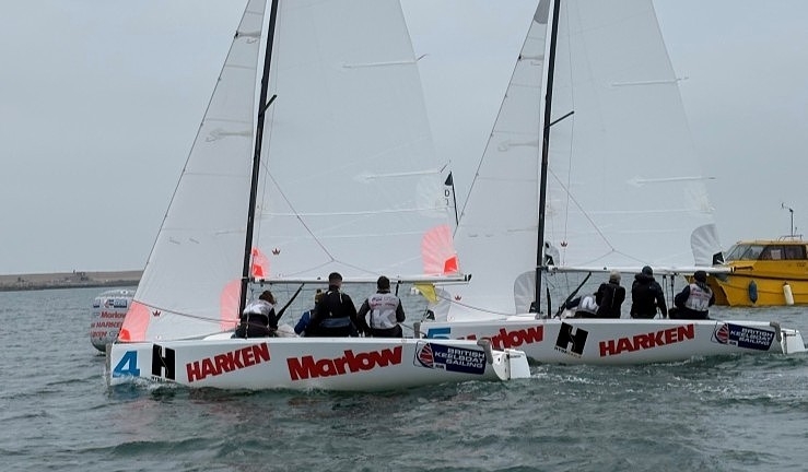 Two teams match racing Elliott 6M keelboats upwind on a grey day at Qualifier 1 of the RYA Match Racing 2025 series.