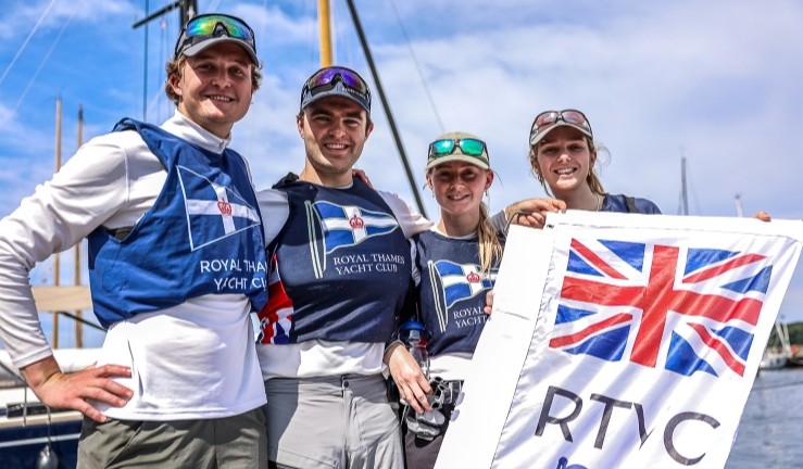 Royal Thames YC academy team with their Union Jack & club  team flag at SAILING Champions League final 2025.