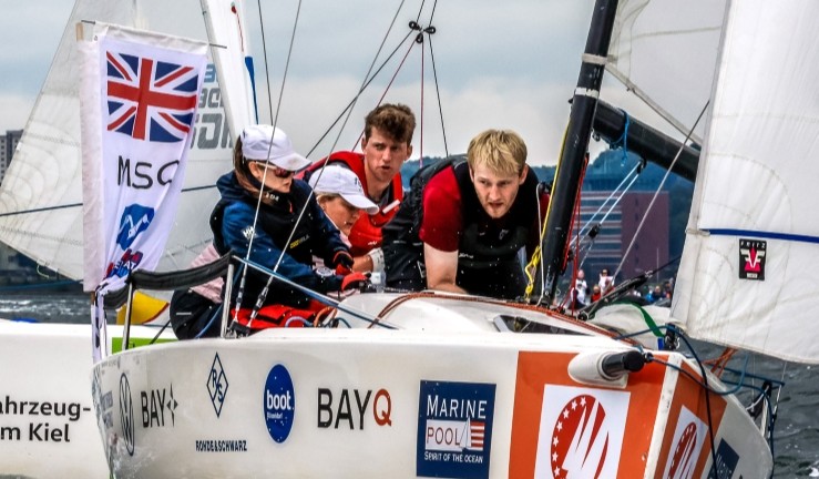 Marconi SC team competing aboard keelboat at SAILING Champions League final 2025.