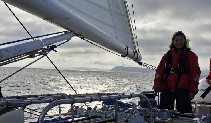 RYA CW's Hester Walker on duty aboard the Challenge Wales sail training ship on a grey day in fading light.