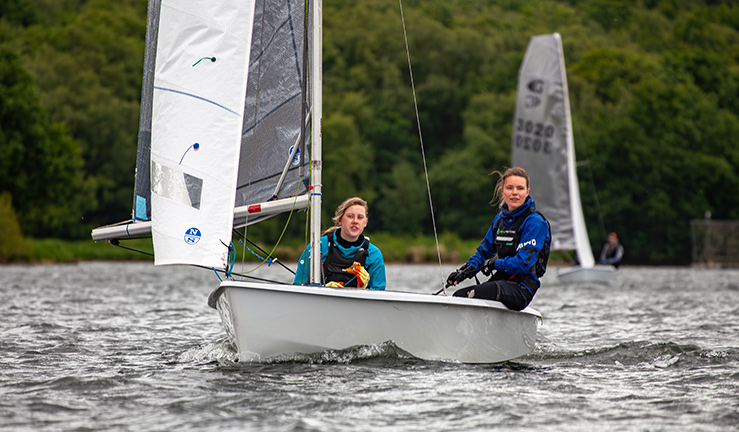 Two women club dinghy racing