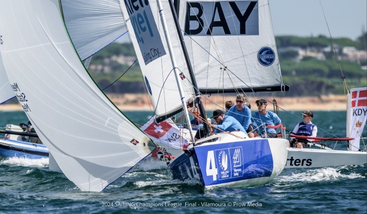Keelboat with spinnaker flying downwind at SAILING Champions League 2024 final in Vilamoura, Portugal.