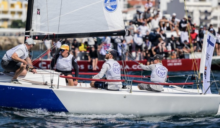 Close keelboat racing with spectators in background at SAILING Champions League 2024 final in Vilamoura, Portugal.