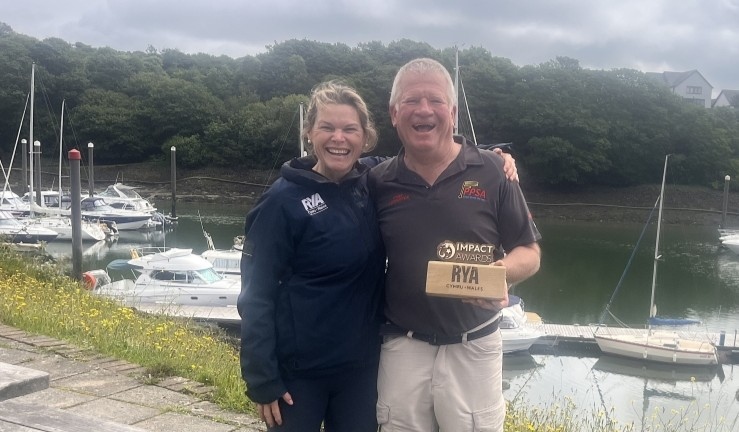 RYA Cymru Wales Club Development Officer Hester Walker presenting an Impact Award to Richard 'Taff' Owens of PPSA.