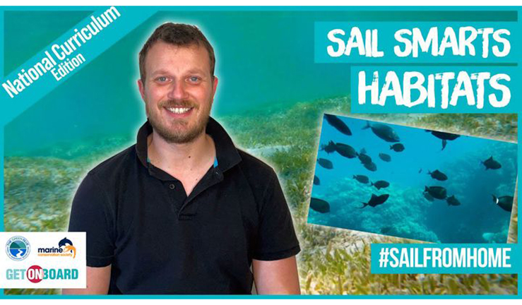 Sail Smarts host Jake in front of habitats video background