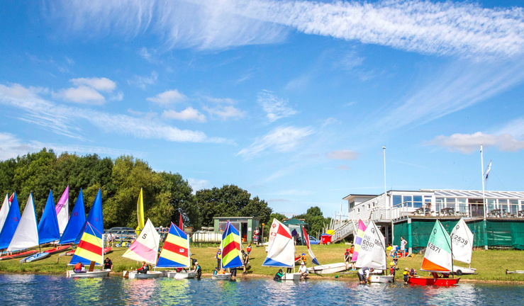 Optimists on shoreline at sailing club