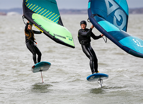 Man and woman Wingfoiling