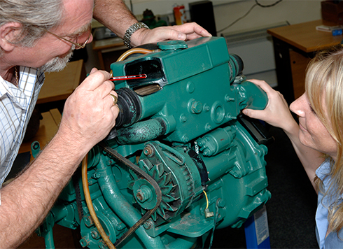 Man pointing to diesel engine