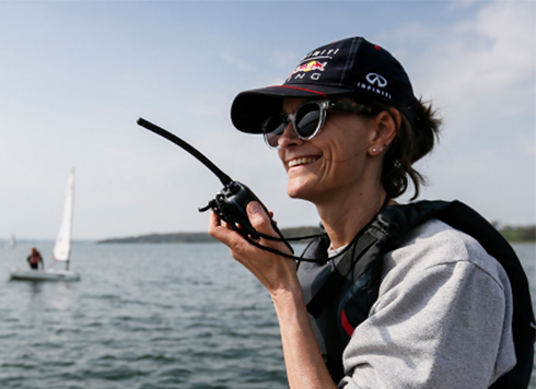 Woman using handheld VHF radio