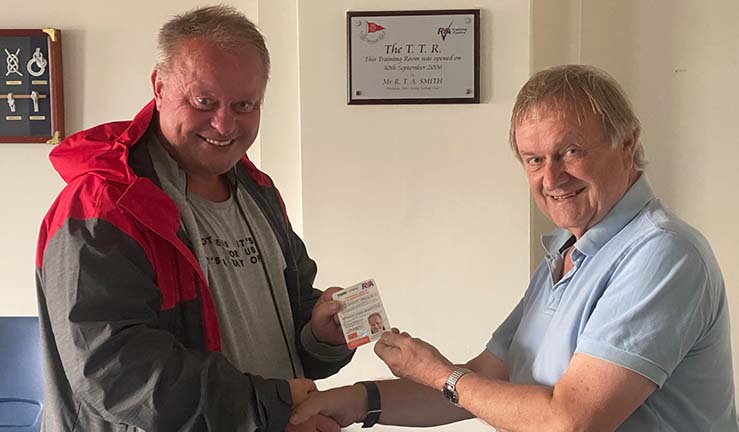 Dave Kelly being presented with his certificate by Club President Peter Bramley
