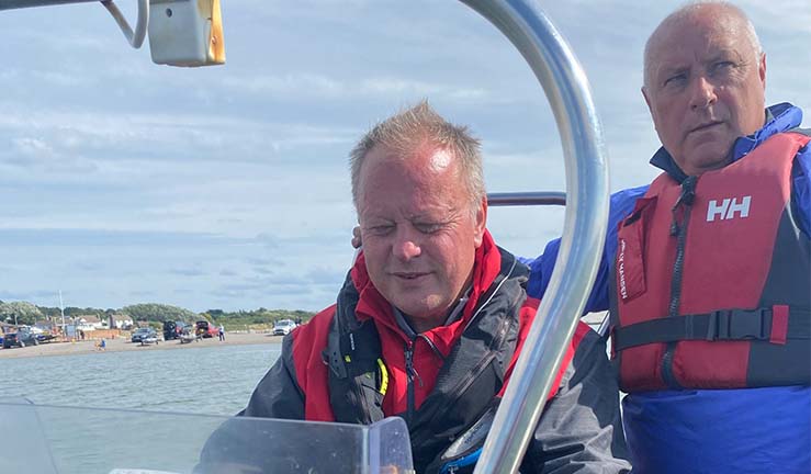 Dave Kelly on the helm of the RIB with Brendan Little (standing)