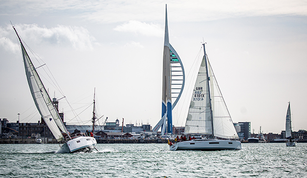 Two yachts sailing in front of the spinnaker tower in Portsmouth