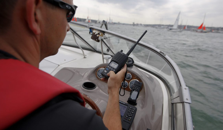 Person holding VHF radio