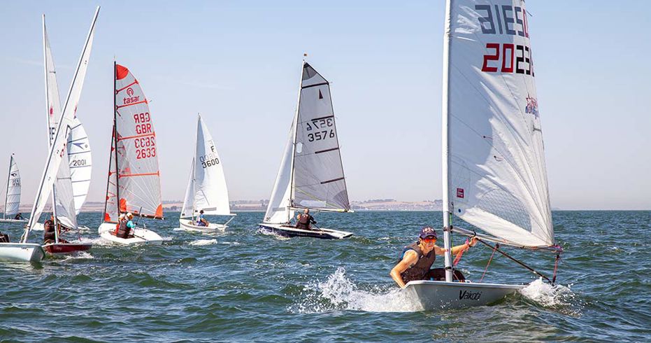 numerous dinghies in the ocean racing