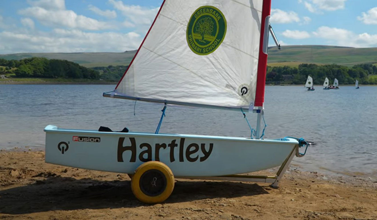 An Optimist dinghy named after Rochdale headteacher Sandra Hartley, who's been presented with an RYA Impact Award for her commitment to outdoor learning