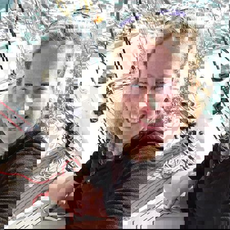 Posed Profile Shot of Sailor on Dinghy