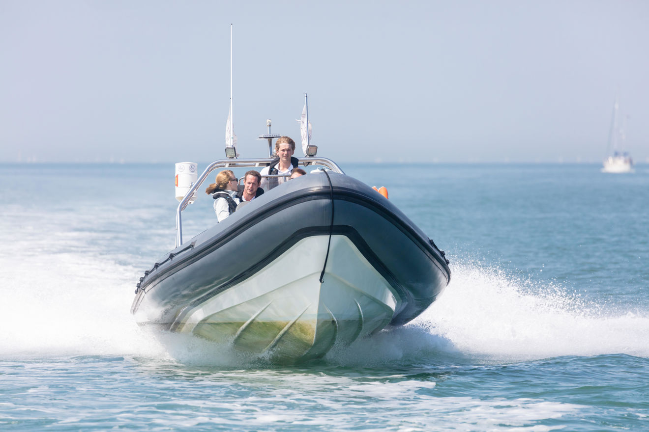 group of people riding a powerboat safely
