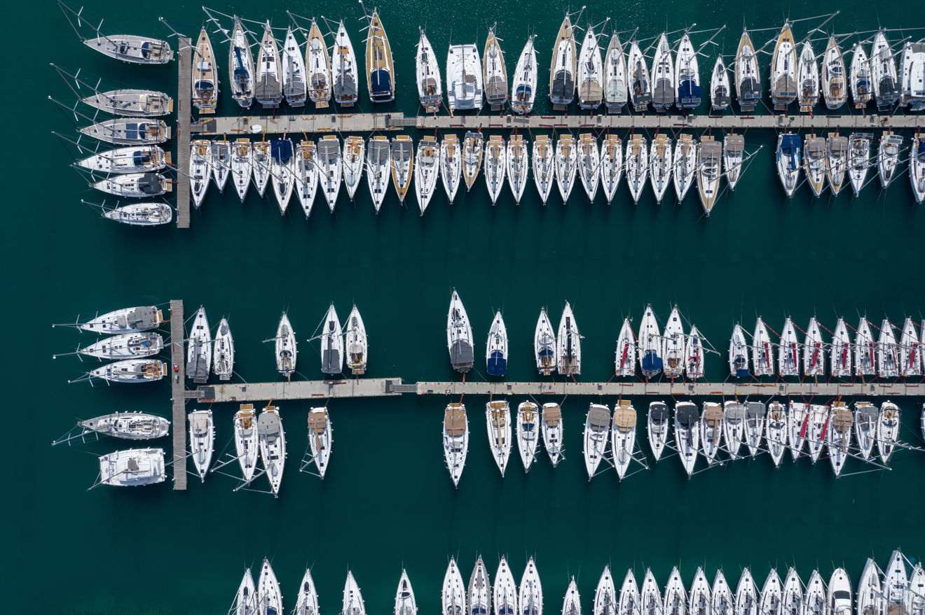 Birdseye view of boats moored at marina