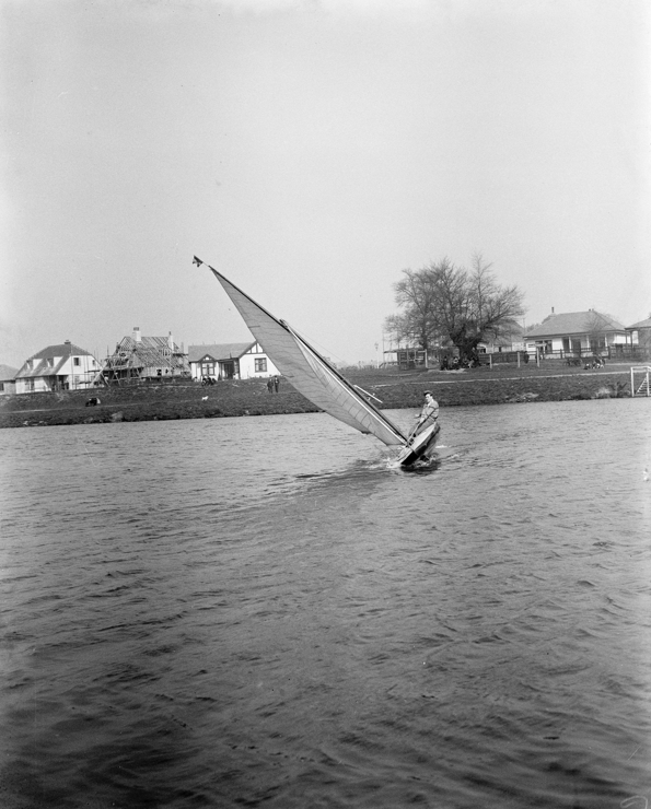 Black and white image of a dinghy sailor