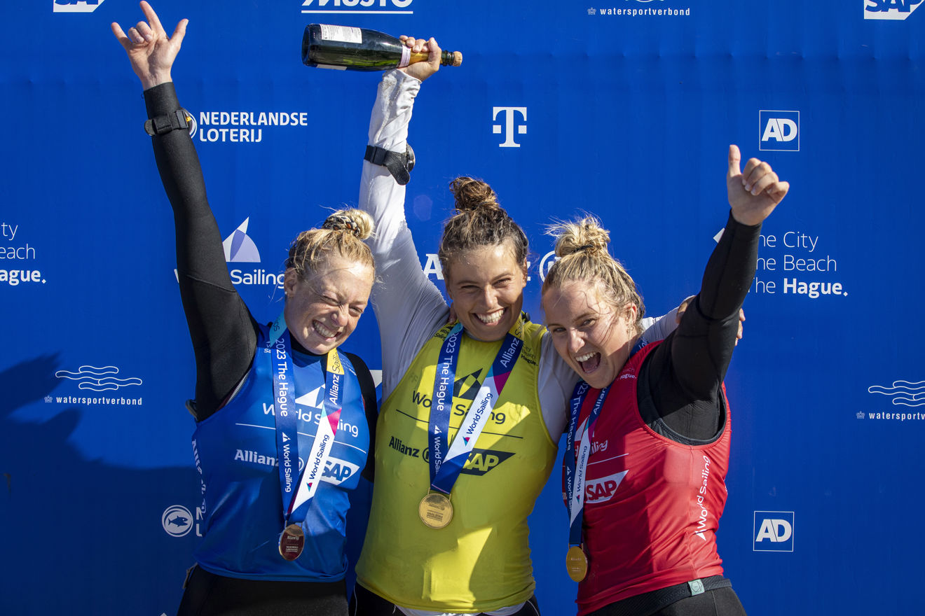 Britain’s kite girls Sailing World Championships event where three girls wearing medals are smiling on their win