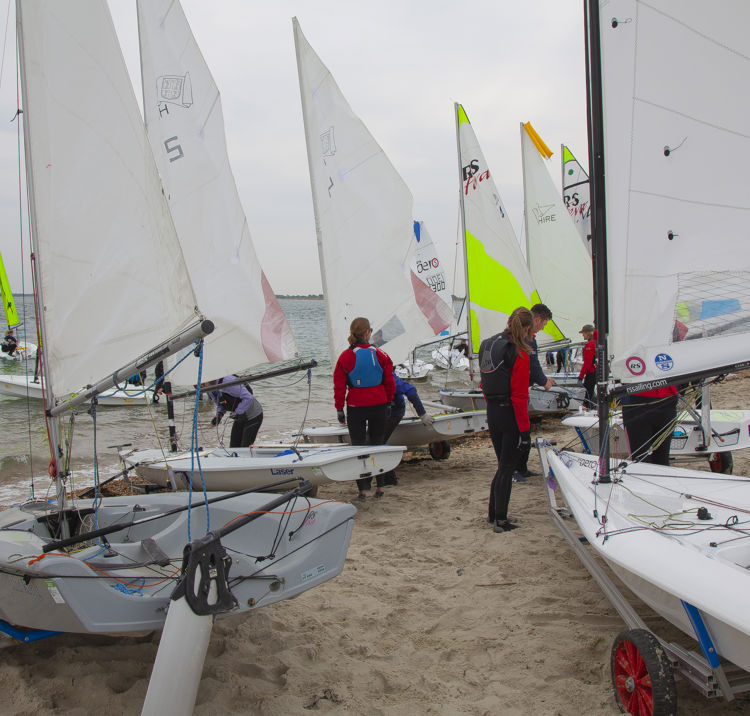 Dinghies on the shore before a session on the water