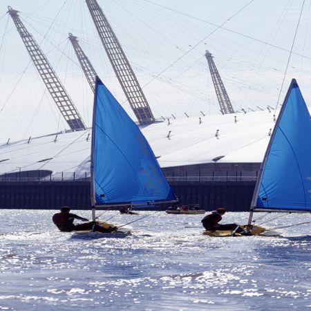 Dinghy sailors in the Thames alongside O2 arena 
