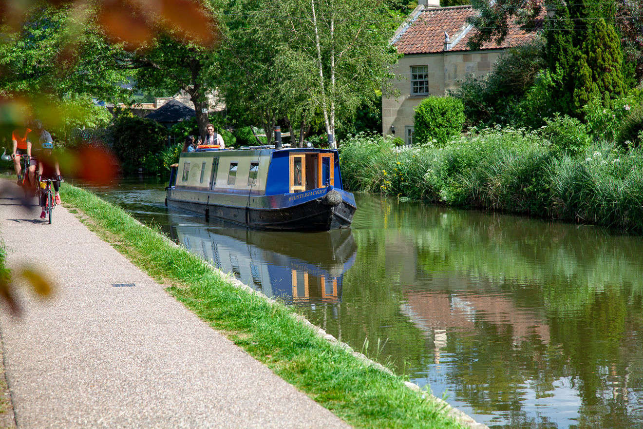 Long shot of canal boat on water