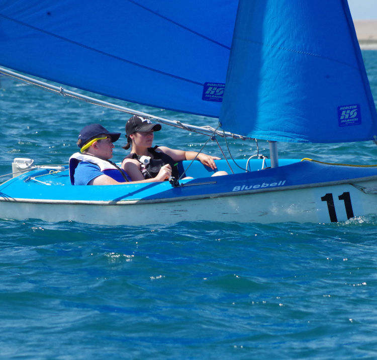Two people sailing double handed dinghy 