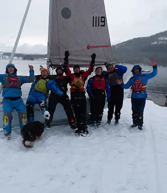 People enjoying sailing in snowy conditions