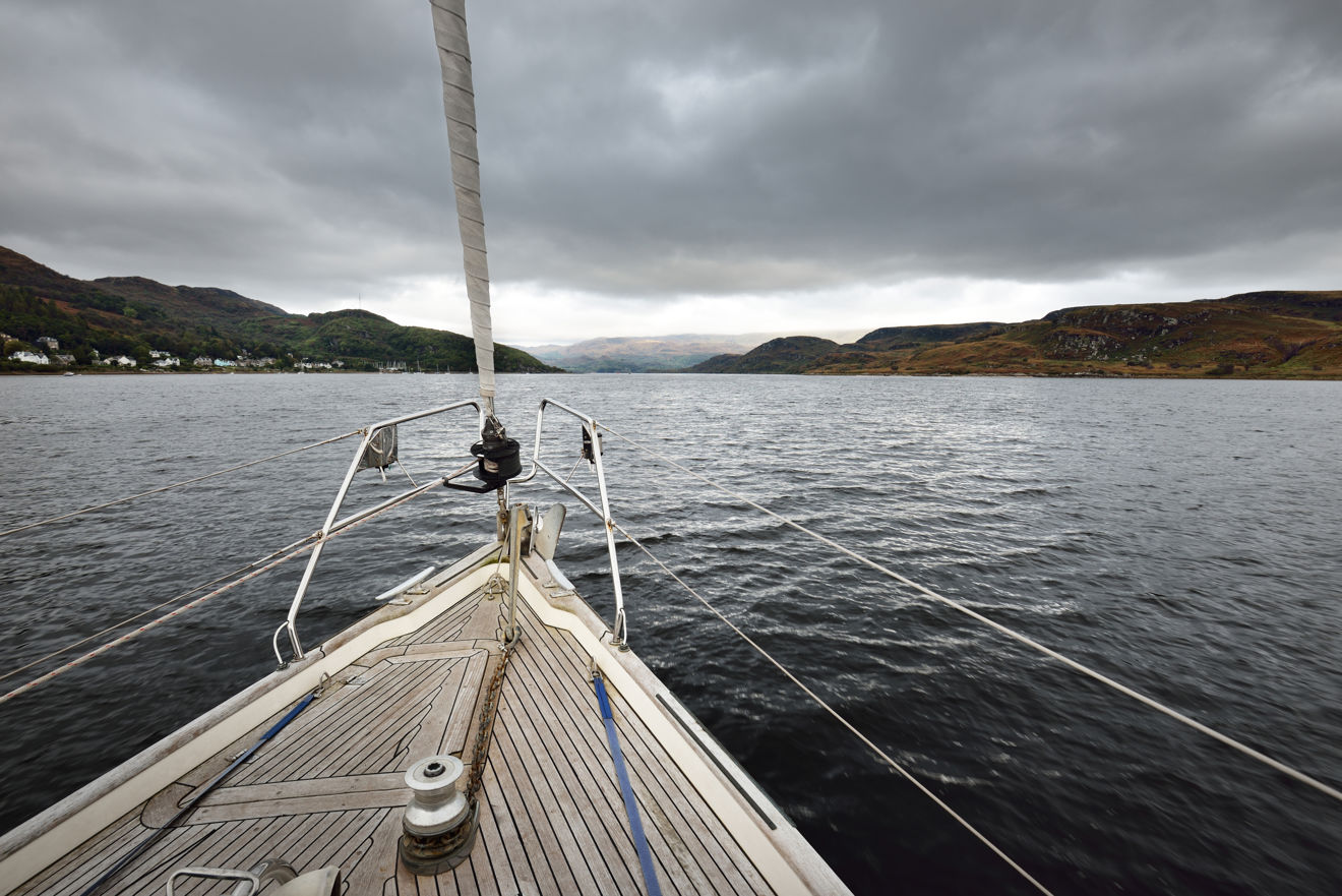 Mid shot of boats bow as it sails through the water