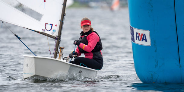 Sailor dinghy sailing on the water