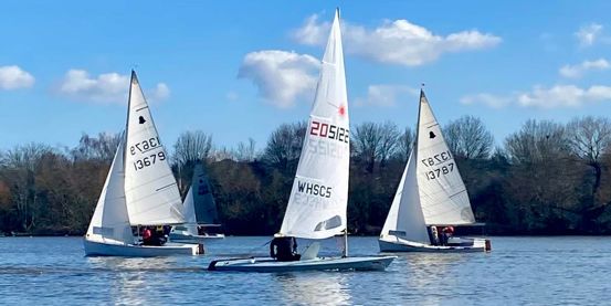 Long shot of Welsh Harp Sailing Club's boats on water