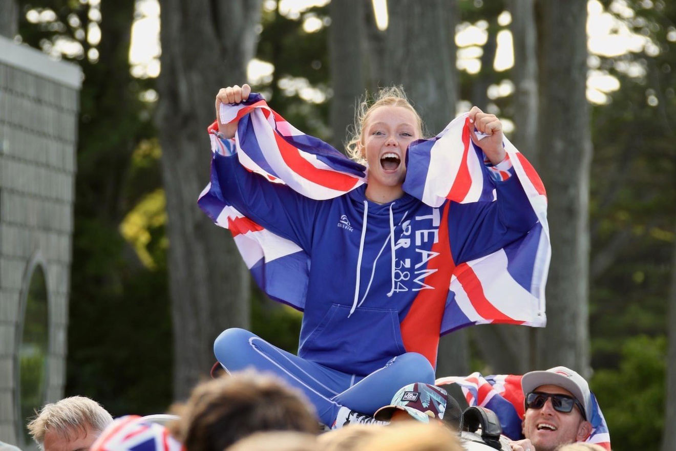 Young child celebrating and holding a union jack