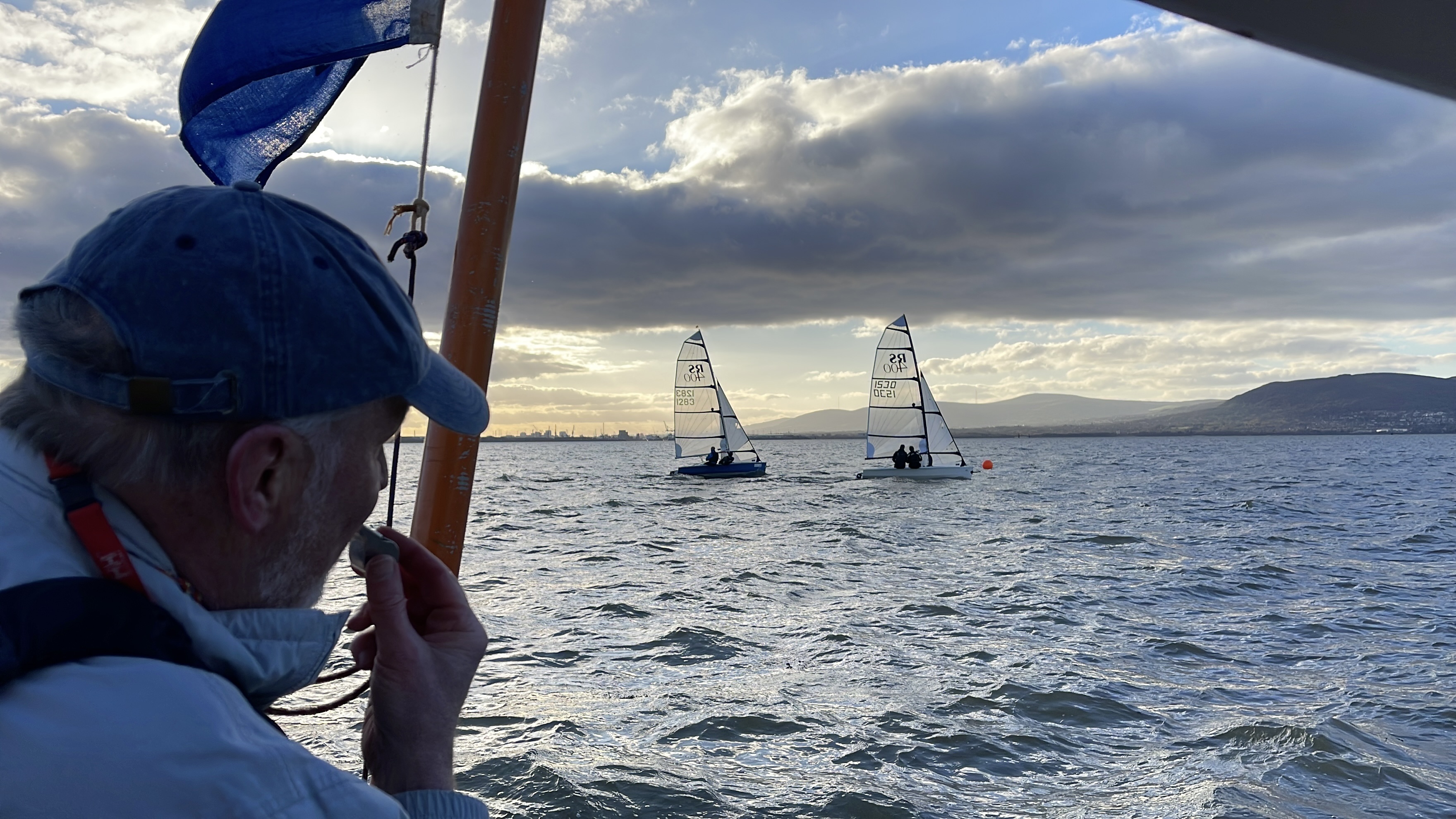 Race Officer looks out at fleet of RS400s in Belfast Lough