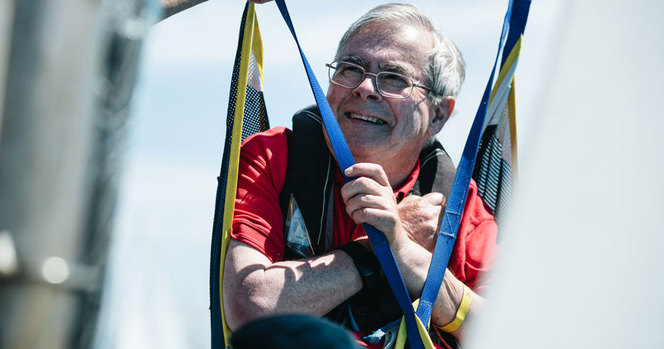 wheelchair user being lowered into boat