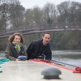 couple enjoying a winters day on their canal boat