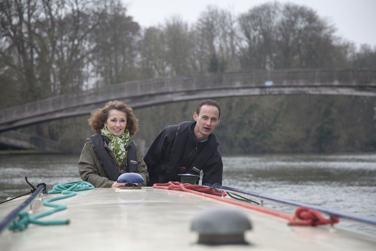 couple enjoying a winters day on their canal boat