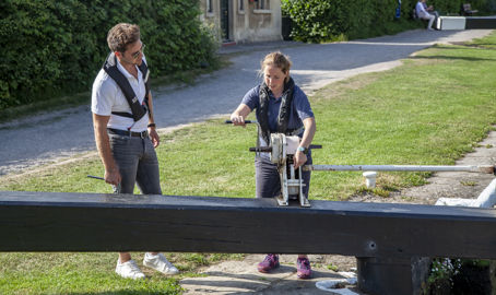 Trainer showing trainee how to operate canal lock