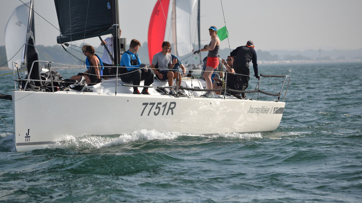 group of young people on sail boat