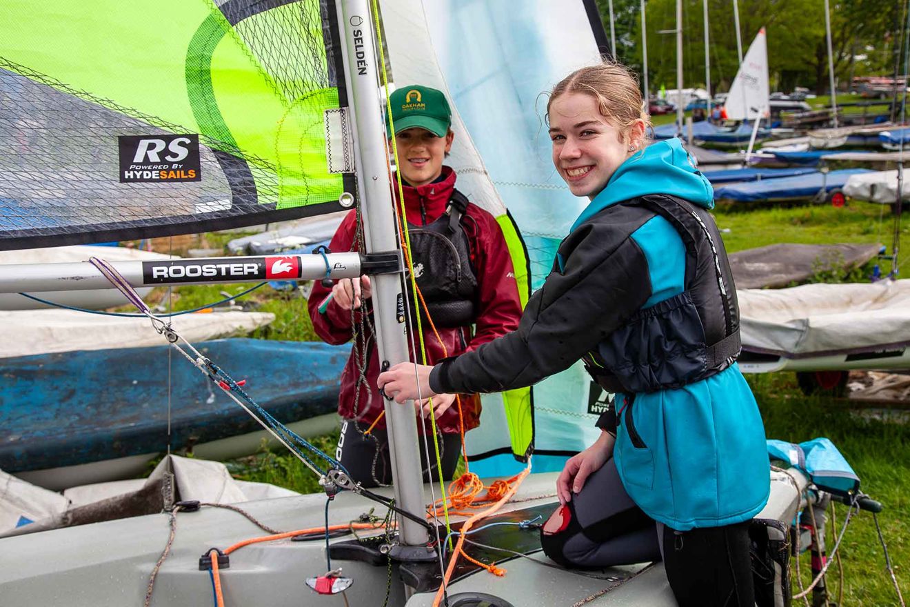 Two girls rigging up ready to race at the at the RYA Eric Twiname Championships