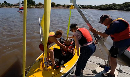 Snettisham Beach SC Sailability hoisting into a Hansa 303